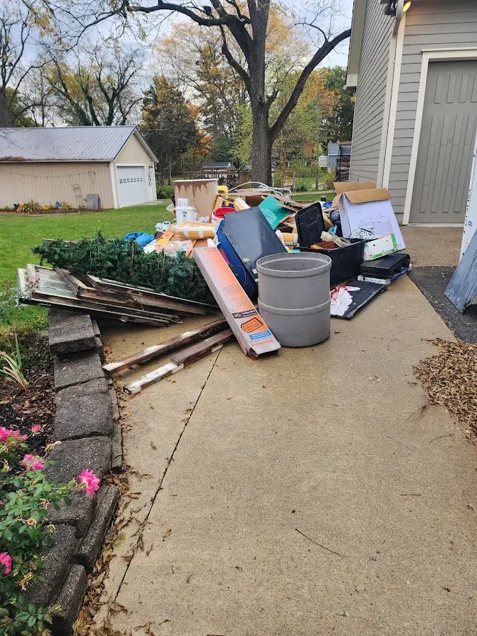 Dumpster being loaded with debris for 30 Yard Dumpster Rental in Trumbull